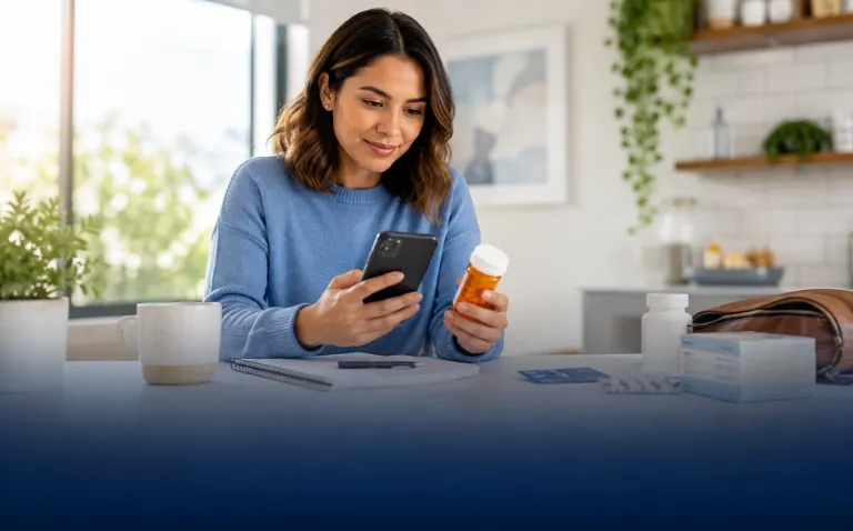Prescription bottle and notepad listing drug name, strength, quantity, dosage form and ZIP code before comparing pharmacy prices